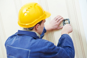 Electricians at cable wiring work